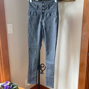 Woman’s grey skinny jeans